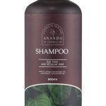 Ananda Organic shampoo bottle in a deep burgundy color, with a wooden pump, designed for thin and regular hair, highlighting its 500ml volume and leafy green imagery