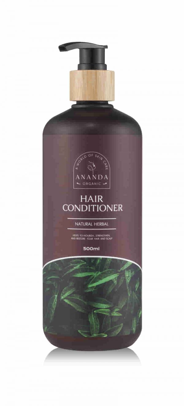 Ananda Organic Hair Conditioner bottle with wooden pump, labeled as 'Natural Herbal' and designed with green herbal leaf imagery. 500ml volume indication